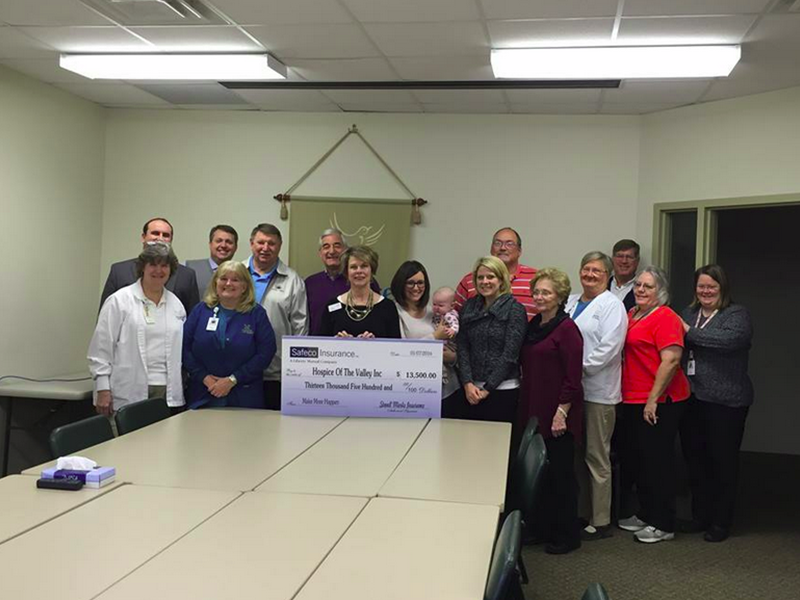 Stovall Marks Insurance Team donating check to Hospice of the Valley Inc.